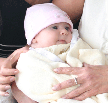 Newborn swaddled in blanket