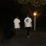 Teens walking toward lamplight