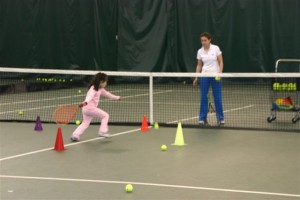 3-year-old playing tennis