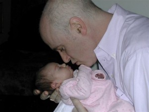Father nose to nose with infant