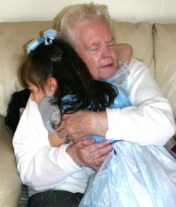 Grandma hugs 3 year old