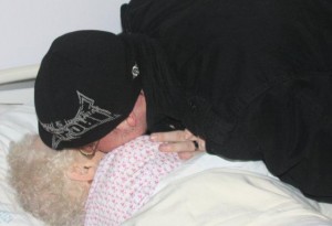 Grandson kisses grandma