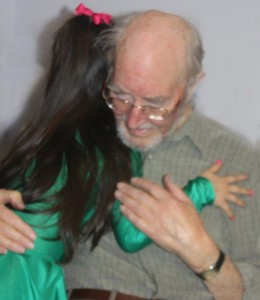 Granddaughter hugs Granddad