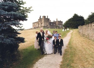 English medieval castle, walking to the moat, wedding party walking together