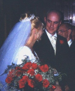 Groom smiles at bride, knowing smile, romance, roses