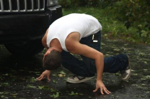 Hurricane Irene, teen looks under hood, teen looks under car, teen and his car