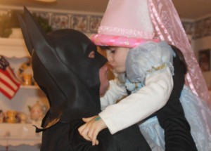 Batman kisses princess little daughter kisses dad dad kisses little daughter princess Caped Crusader