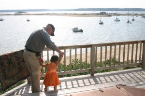 Beach house Father teaches daughter to walk toddler walking walking toddler beach view water view