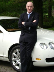Bentley Phillip sports cars Bentley sports car man in business suit Host of Let's Talk radio show
