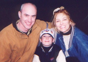 Central Park Horse Carriage New York City happy family huge smiles smiling family parents and son - a