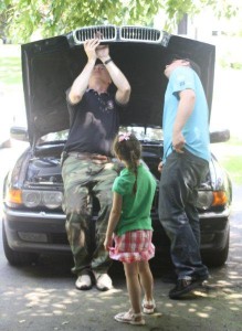 Dad fixing car Dad fixing while kids watch Dad and 2 kids Phillip Let's Talk radio host
