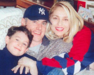 Happy family Father mother and son parents and son New York Yankees family in embrace