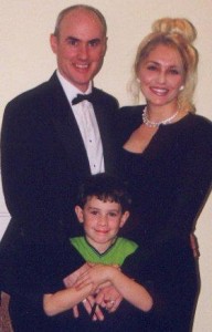Loving family gala event parents and son loving embrace tuxedo and gown