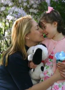 Mom and daughter snuggle nose to nose, cuddles, hugs, love, warmth, tenderness, sippy cups, pink sweaters, flower dresses, Snoopy