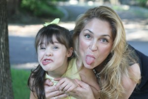 Daughter and mom goofing around, daughter and mom making silly faces, sticking out tongue, silly pics, 