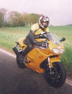 Motorcycle Phillip on yellow motorcylce Triumph motorcycle English countryside motorcycle