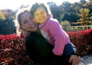 Sunbeam on mom and toddler, mom and daughter, autumn day, glorious day