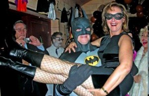 man The Caped Crusader Batman lifts woman Batman saves woman Gotham City New York City Doubles Club Sh_