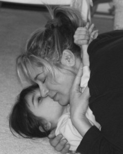 Mom and daughter snuggling, hugs and smooches