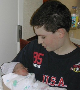 Superhero and Little Petal, Big Brother, little sister, 1st Day of Life, proud big brother holds baby sister