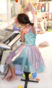 Keyboard  6 year old on keyboard  fairy plays piano