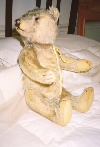 The 1-Eyed Teddy Bear, Steiff, Steiff teddy bear, old bear, loved bear, teddy bear, James Bond, James Bond's bear, James Bond's teddy bear, teddy on the bed, revered bear, revered teddy