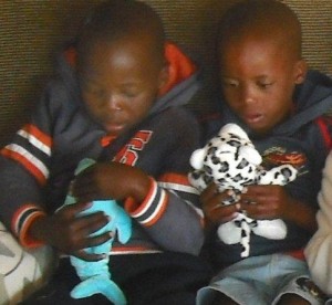 Orphans, stuffed animals, given with love, children snuggling new animals, Africa, love, swells our hearts